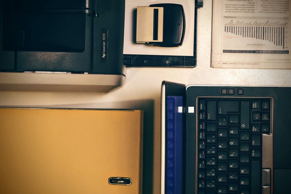 laptop, printer, office, folder, graph, newspaper, business, dell, keyboard, rubber stamp, accountant, office work, table, printer, printer, printer, printer, printer, dell, dell, accountant